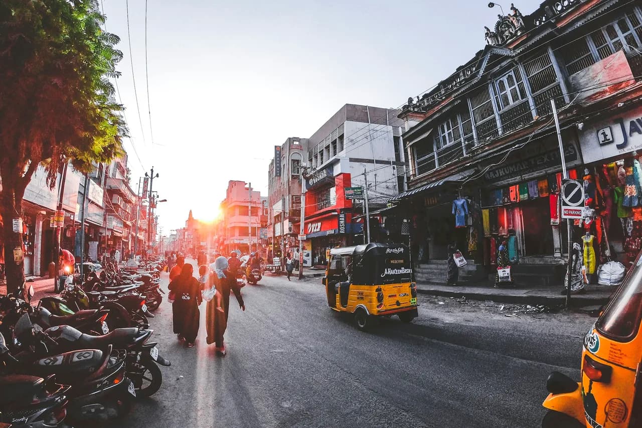 People and vehicles on a street, Madurai